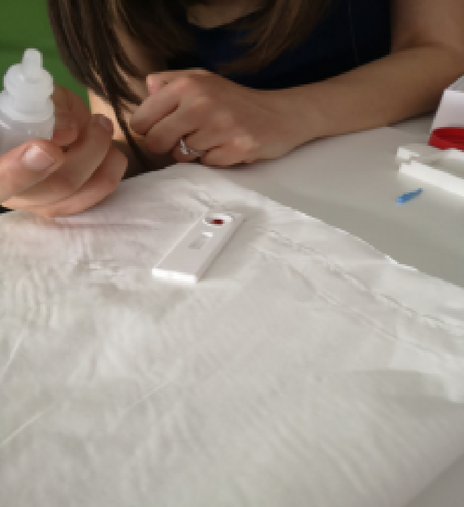 Adding blood sample to the lateral flow test device